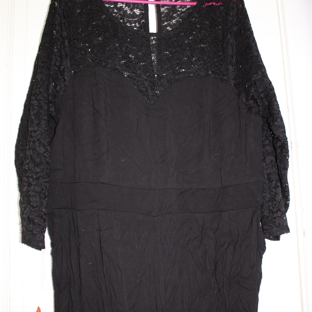 Torrid: Lace long sleeved jumpsuit with heart shaped neckline